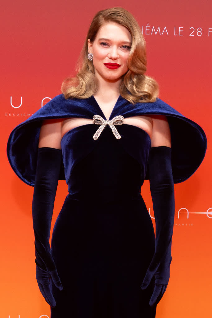 Léa in a velvet gown with a wide collar and long gloves, posing at a "Dune" event