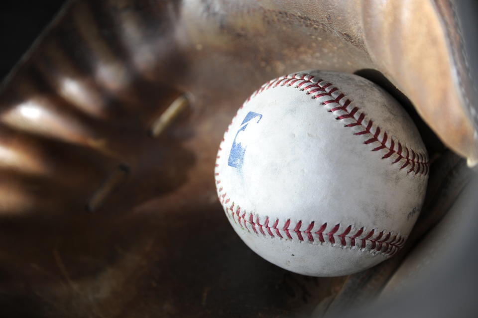 GLENDALE, AZ - FEBRUARY 19:  A batting practice baseball rests in a catchers mitt during Chicago White Sox spring training workouts on February 19, 2014 at The Ballpark at Camelback Ranch in Glendale, Arizona. (Photo by Ron Vesely/MLB Photos via Getty Images)  ***