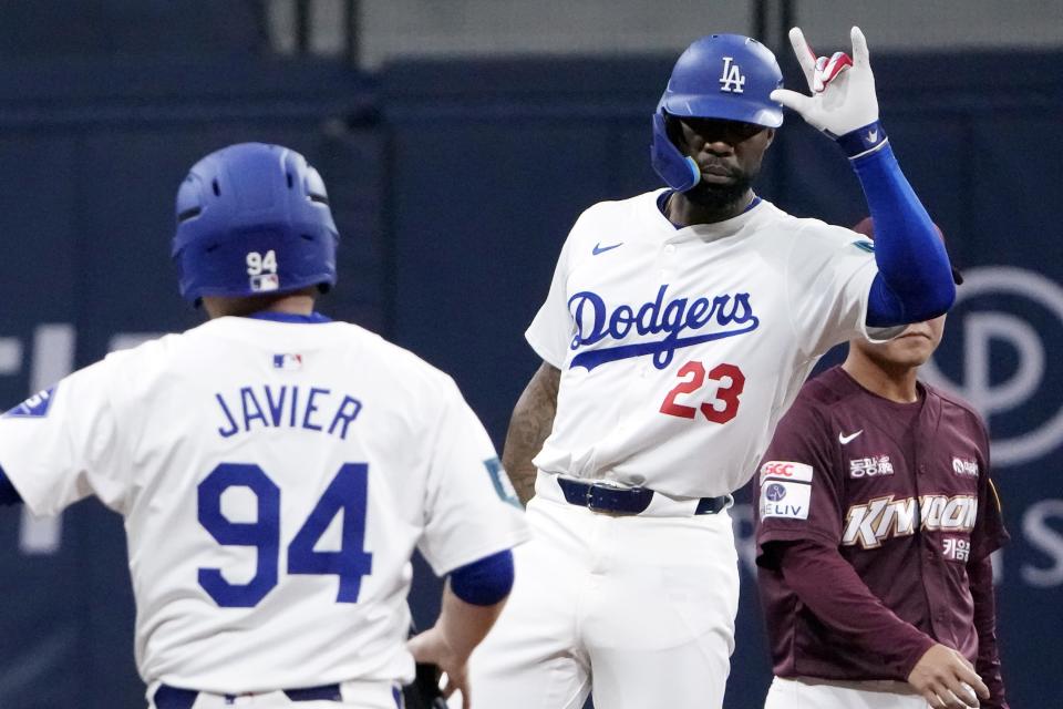 Los Angeles Dodgers' right fielder Jason Heyward cerebrates his hit during the second inning of the exhibition game between the Los Angeles Dodgers and Kiwoom Heroes at the Gocheok Sky Dome in Seoul, South Korea, Sunday, March 17, 2024. The Los Angeles Dodgers and the San Diego Padres will meet in a two-game series on March 20th-21st in Seoul for the MLB World Tour Seoul Series. (AP Photo/Ahn Young-Joon)