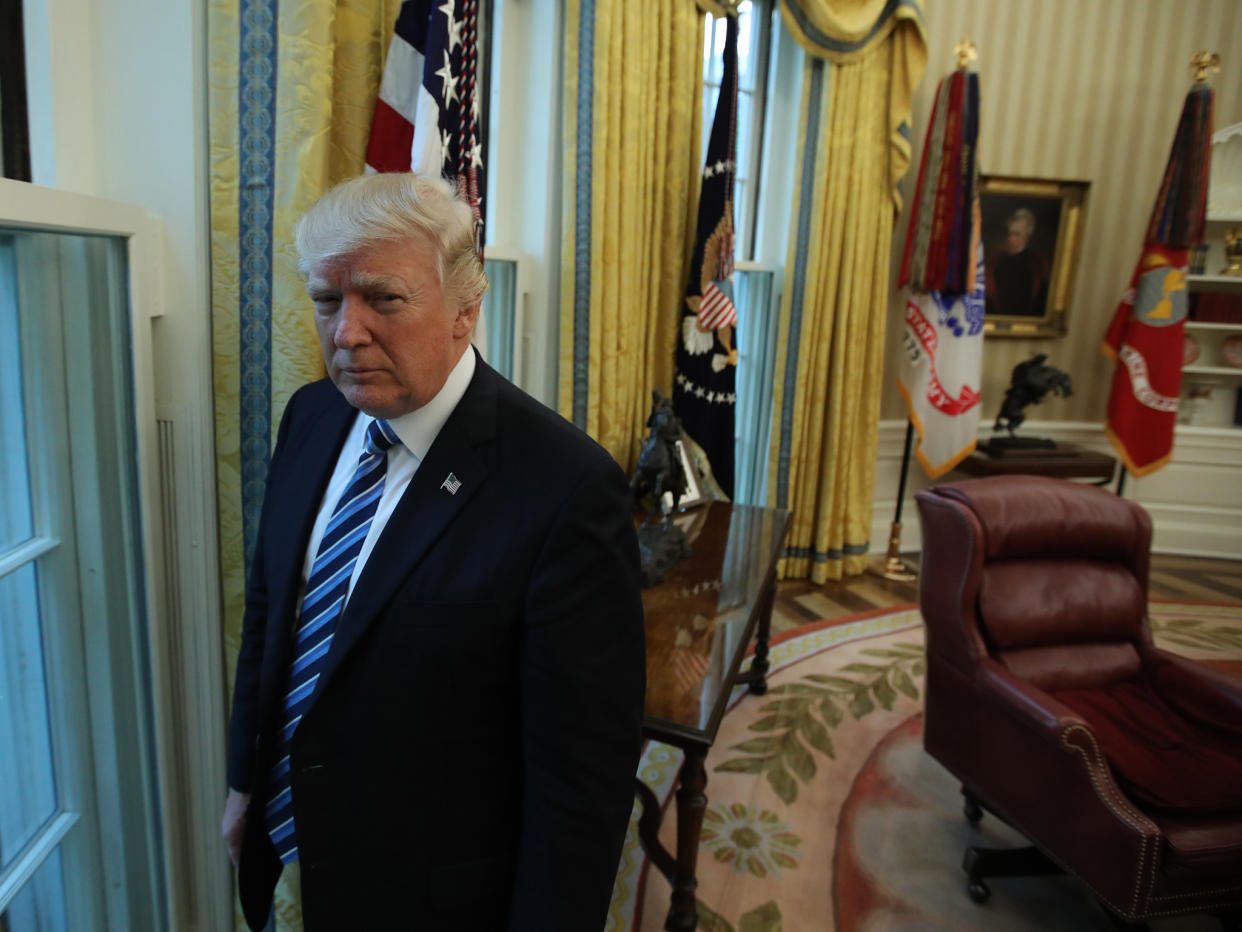 President Donald Trump stands in the Oval Office: REUTERS