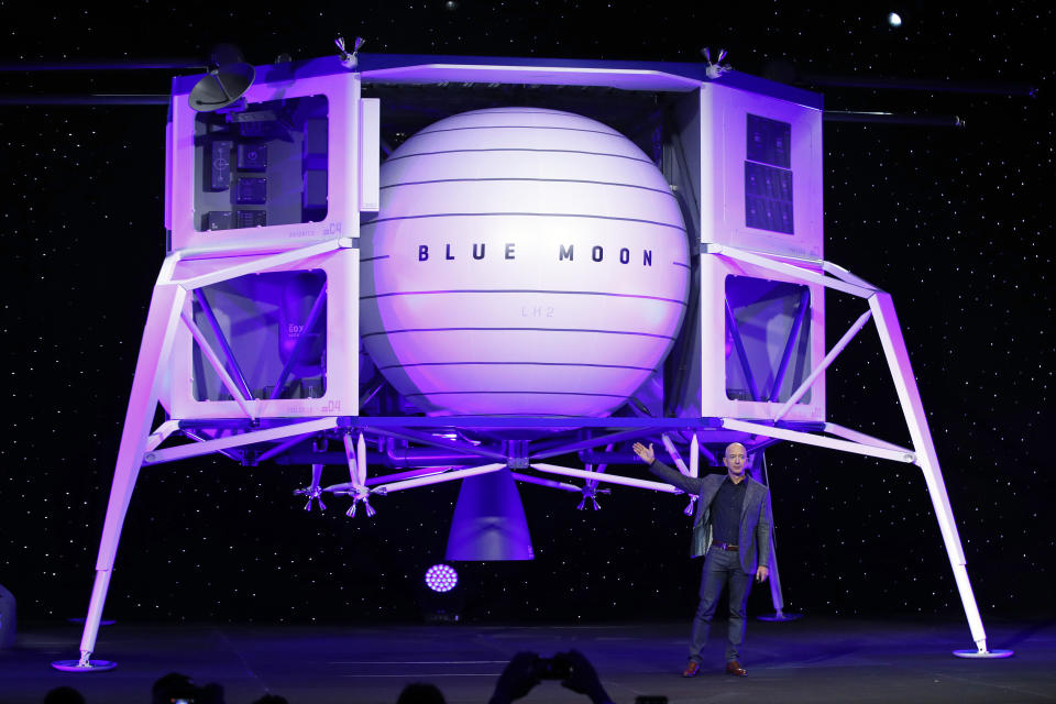 FILE - In this Thursday, May 9, 2019 file phto, Jeff Bezos speaks in front of a model of Blue Origin's Blue Moon lunar lander in Washington. In 2020, NASA Administrator Jim Bridenstine said space is currently a $400 billion market, including satellites. Opening up spaceflight to paying customers, he said, could expand the market to $1 trillion. (AP Photo/Patrick Semansky)