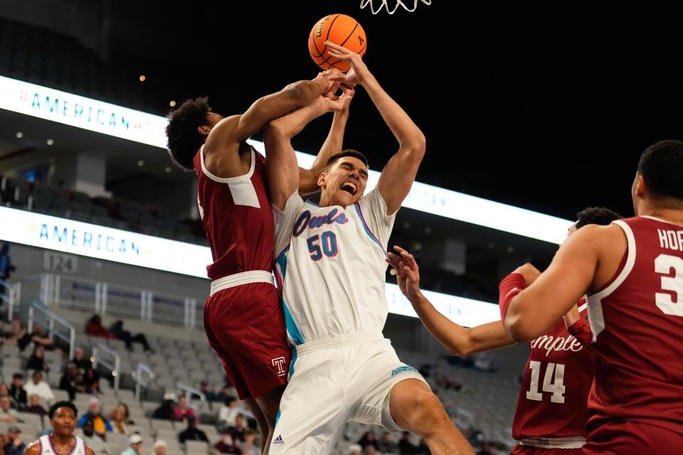 FAU center Vlad Goldin (50) battles with Temple's Jordan Riley during Saturday's AAC semifinal in Fort Worth, Texas.