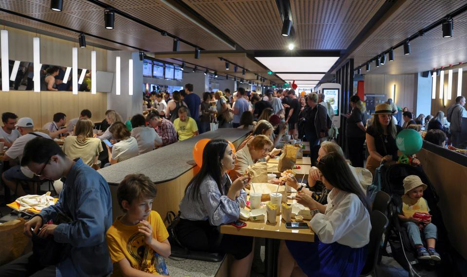 People visit the new restaurant "Vkusno & tochka", which opens following McDonald's Corp company's exit from the Russian market, in Moscow, Russia June 12, 2022.