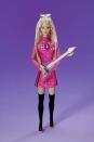 <p>Lead Singer Barbie puts a '90s spin on her rock-and-roll look, with a high-necked mesh-sleeved mini and thigh-high boots.</p>