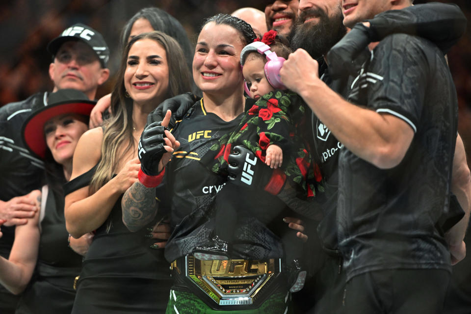 Jan 20, 2024; Toronto, Canada, USA; Raquel Pennington (red glove) celebrates defeating Mayra Bueno Silva (blue gloves) during UFC 297 at ScotiaBank Arena. Mandatory Credit: Dan Hamilton-USA TODAY Sports