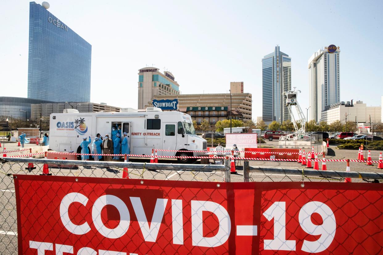 Medical workers prepare for the opening of a COVID-19 test location in a parking lot near the casinos in Atlantic City, N.J. on Tuesday, April 28, 2020.