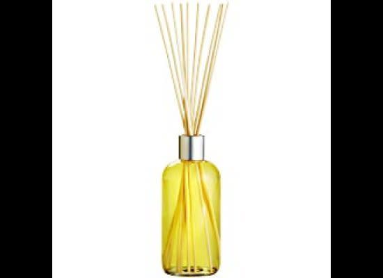 A <a href="http://www.pier1.com/Catalog/CandlesFragrance/tabid/976/List/0/CategoryID/101/level/a/ProductID/37054/ProductName/Reed-Diffuser--Polynesian-Gardenia/Default.aspx" target="_hplink">yellow reed diffuser</a> keeps a room from feeling stale. This one gives off a fresh gardenia scent.