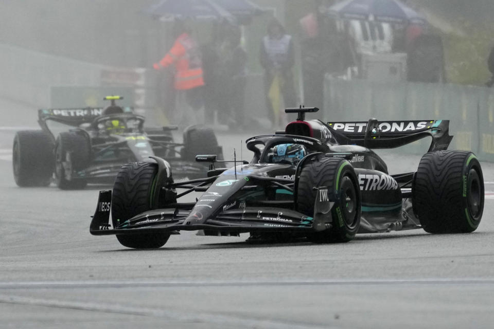 Mercedes driver George Russell of Britain leads teammate Lewis Hamilton of Britain, left, during the sprint race ahead of Sunday's Formula One Austrian Grand Prix auto race, at the Red Bull Ring racetrack, in Spielberg, Austria, Saturday, July 1, 2023. (AP Photo/Darko Vojinovic)