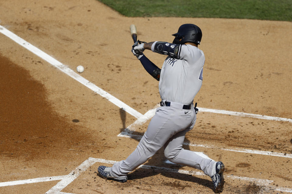 New York Yankees' Gleyber Torres bats in a run-scoring double play off Philadelphia Phillies starting pitcher Zack Wheeler during the first inning of the first baseball game in doubleheader, Wednesday, Aug. 5, 2020, in Philadelphia. (AP Photo/Matt Slocum)