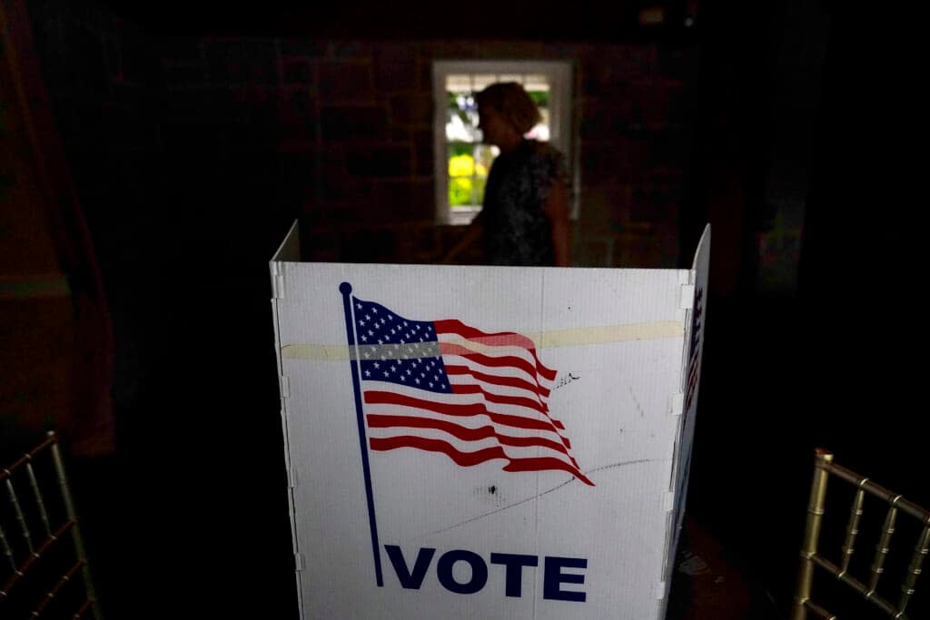 A person waits in line to vote in the Georgia’s primary election on May 24, 2022, in Atlanta. (AP Photo/Brynn Anderson, File)