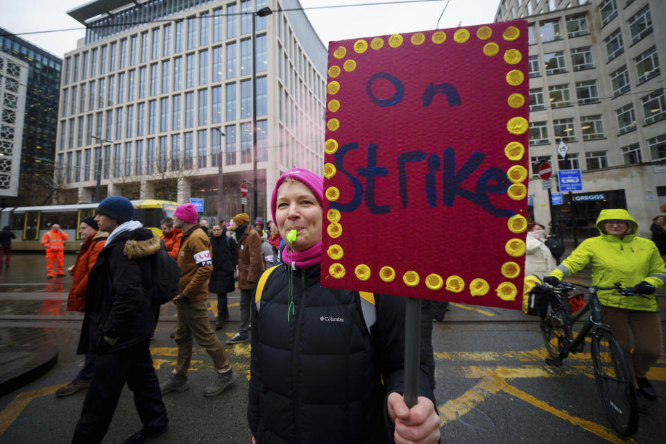 A demonstration in support of strikers is seen in central Manchester, England, Wednesday, Feb. 1, 2023. Up to half a million workers are expected to go on strike across the U.K. in what's shaping up to be the biggest day of industrial action Britain has seen in more than a decade. (AP Photo/Jon Super)