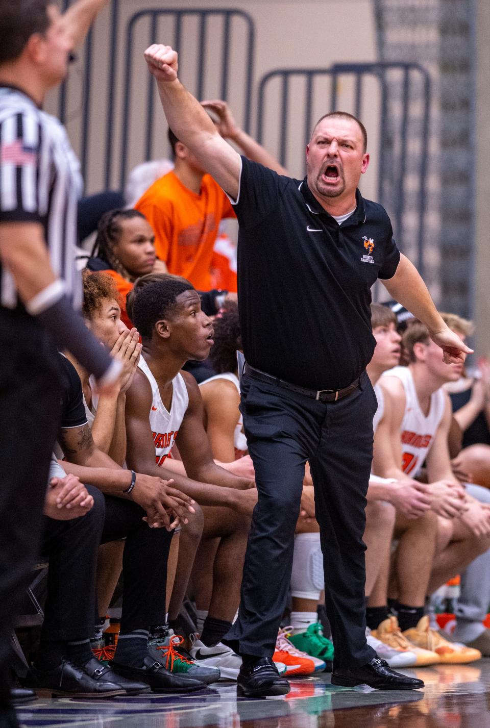 Beech Grove High School head coach Mike Renfro reacts to action on the court during the first half of an IHSAA Boys’ Regional Basketball championship game against Danville High School, Saturday, March 12, 2022, at Greencastle High School.