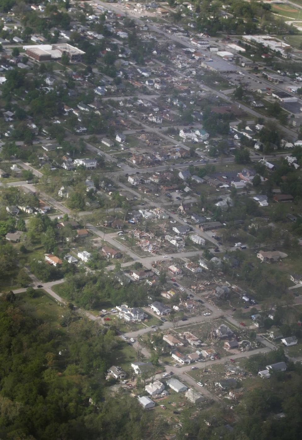 A tornado's path is seen in an aerial photo made over Baxter Springs, Kan., Monday, April 28, 2014. A tornado damaged dozens of buildings and injured at least 25 people on Sunday. (AP Photo/Orlin Wagner)