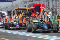 Aston Martin driver Lance Stroll of Canada steers his car down pit lane during the first practice session of the Australian Formula One Grand Prix at Albert Park, in Melbourne, Australia, Friday, March 22, 2024. (AP Photo/Asanka Brendon Ratnayake)