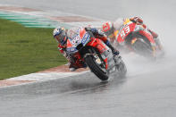 MotoGP Ducati rider Andrea Dovizioso of Italy leads MotoGP Honda rider Marc Marquez of Spain during the Motorcycle Grand Prix at the Ricardo Tormo circuit in Cheste near Valencia, Spain, Sunday, Nov. 18, 2018. (AP Photo/Alberto Saiz)