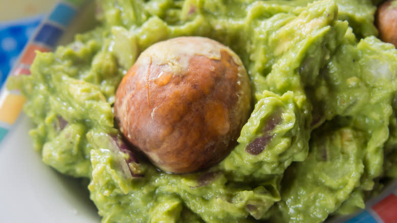 Guacamole with avocado pit in the center