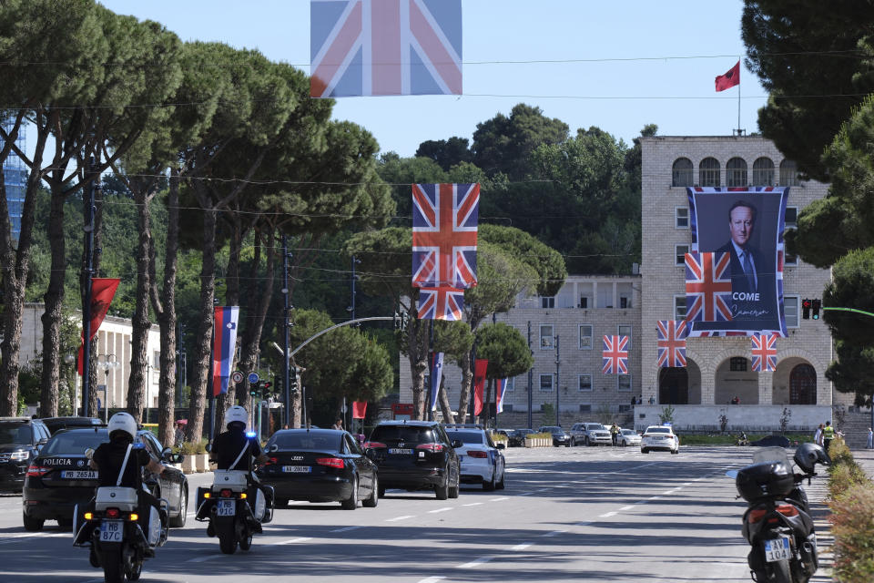 A portrait of British Foreign Secretary David Cameron is attached on a facade at the Tirana University, in Tirana, Albania, Wednesday, May 22, 2024. British Foreign Secretary David Cameron has hailed progress in a U.K.-Albania joint effort to cut illegal migration, saying small boat arrivals from Albania to the U.K. fell by over 90% in 2023, as the two countries fought people smuggling gangs. (AP Photo/Vlasov Sulaj)