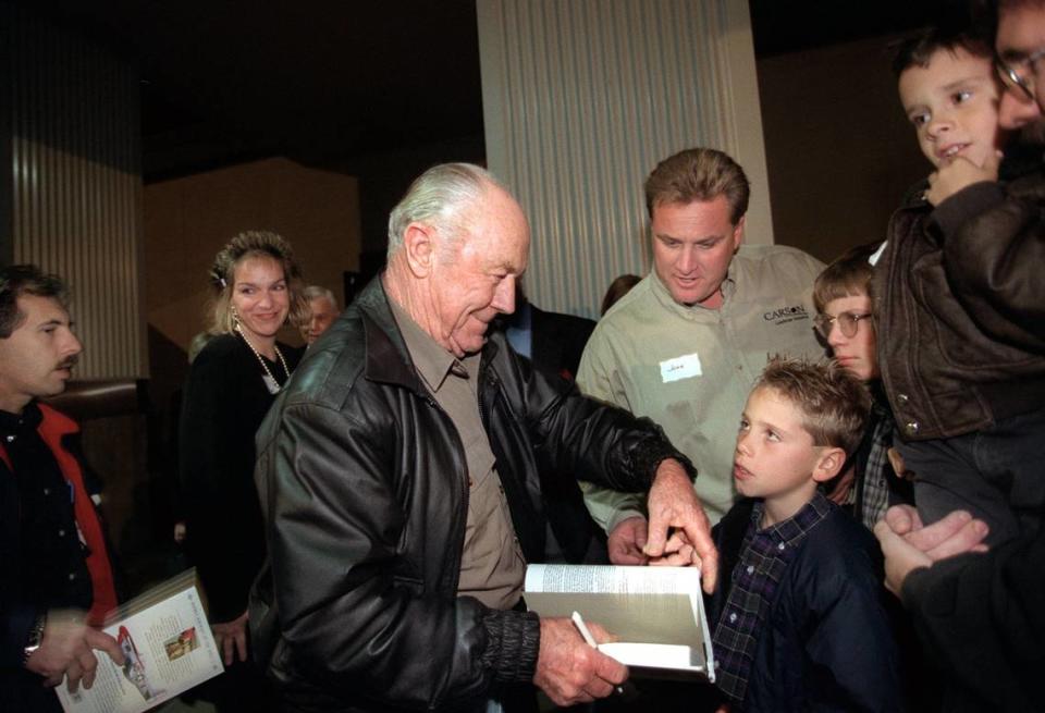 Retired Gen. Chuck Yeager signs autographs for invited guests to the opening of Aces Supper Club in 1999. The club salutes the area’s aviation history when nearby McClellan Air Force base played a key role in the economy of the Sacramento region. A replica of Yeager’s P-51 Mustang WWII-era fighter is displayed above the restaurant. Jose M. Osorio/Sacramento Bee file