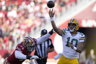 Green Bay Packers quarterback Jordan Love (10) is pressured by San Francisco 49ers defensive end Jordan Willis (75) an NFL preseason football game in Santa Clara, Calif., Friday, Aug. 12, 2022. (AP Photo/Godofredo A. Vásquez)