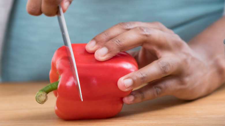 chopping red bell pepper