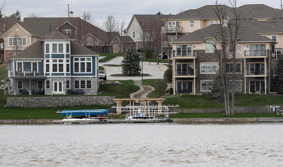 Homes along the water at Geist Reservoir, Fishers, Ind., Monday, March 30, 2020. 