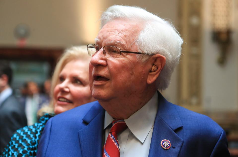 Congressman Hal Rogers and his wife Cynthia looks up at a video screen with photos of him during his career and with former Presidents -- one with Ronald Reagan,  another with Donald Trump -- in the Kentucky Senate chambers Thursday afternoon for a ceremony honoring   Sept. 2, 2021. 