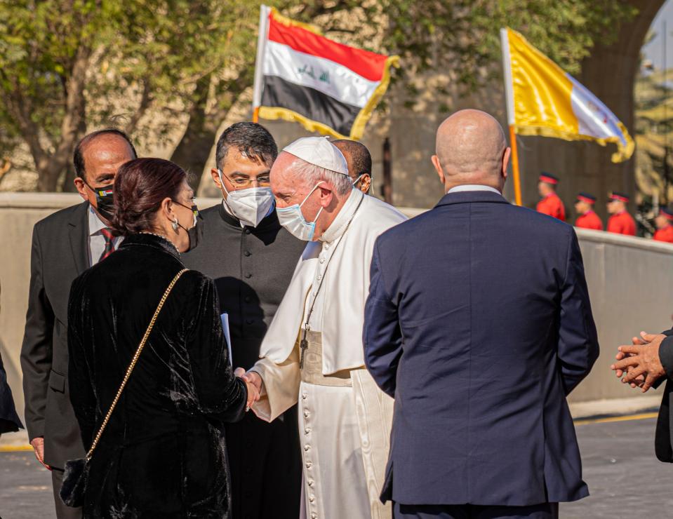 <p>The Pope is greeted at Baghdad airport on Friday at the start of his historic visit</p> (Bel Trew)