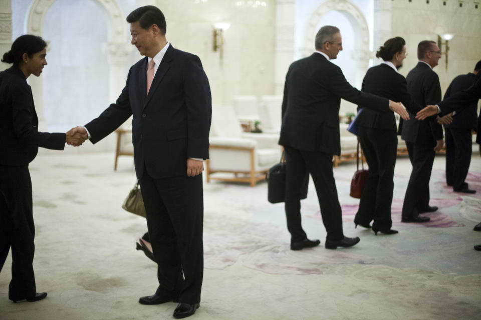 FILE - In this July 18, 2012 file photo, Chinese Vice President Xi Jinping, second from left, shakes hands with visiting U.N. delegates during his meeting with U.N. Secretary-General Ban Ki-moon, unseen, at the Great Hall of the People in Beijing. The world's two biggest economies are entering the final stages of political campaigns to pick their national leaders. While American candidates wage loud, rah-rah campaigns with a clear timetable as they head toward the Nov. 6 presidential election, China hasn’t even announced the date for this fall’s Communist Party congress that will appoint the next top leader to replace outgoing Hu Jintao - a post widely expected to go to Vice President Xi Jinping. (AP Photo/Alexander F. Yuan, Pool, File)