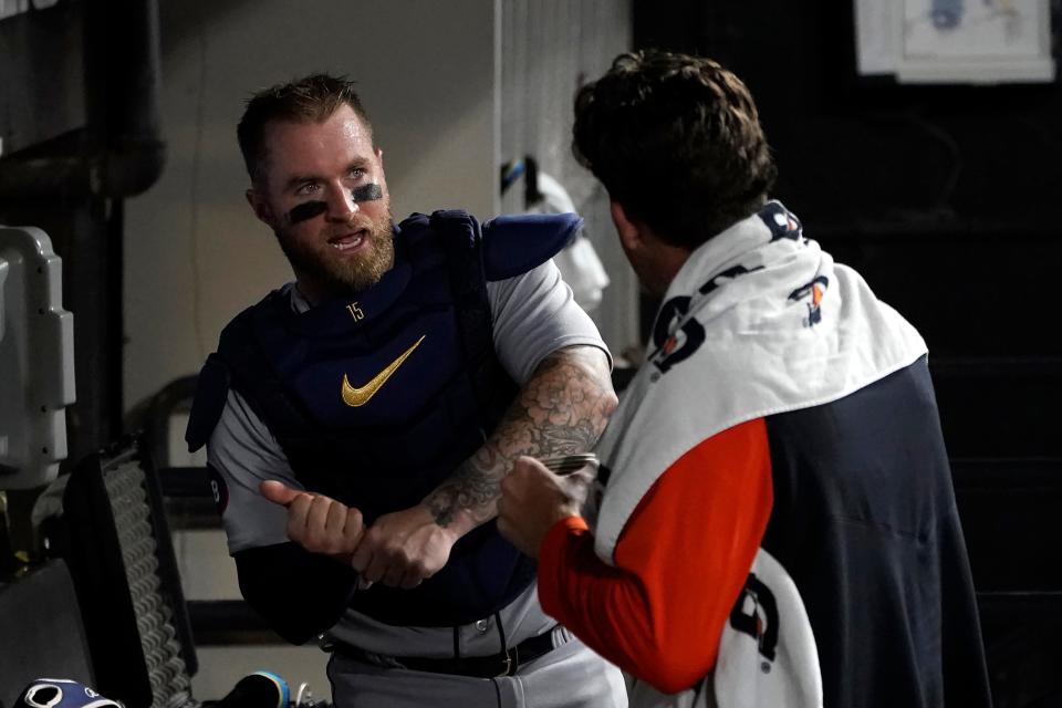 Tigers catcher Tucker Barnhart, left, talks to pitcher Beau Brieske in the dugout during the sixth inning on Thursday, July 7, 2022, in Chicago.