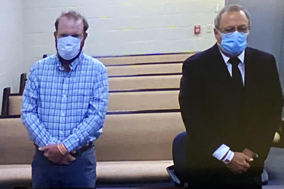 Image: Travis and Greg McMichael listen to a preliminary hearing via a court video feed, on June 4, 2020, while inside the Glynn County Jail, in Brunswick, Ga. (Glynn County Jail via AP file)