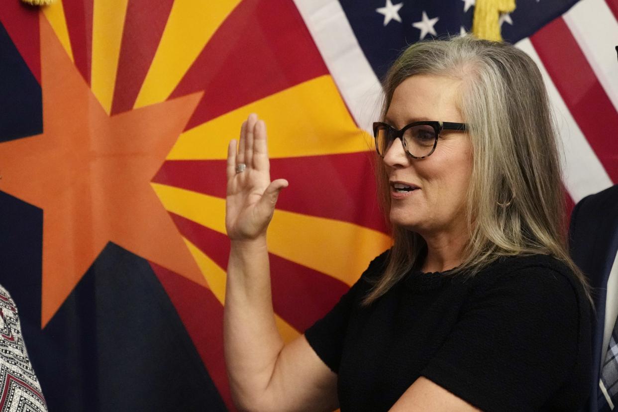 The new Arizona Democratic Gov. Katie Hobbs takes the oath of office in a ceremony at the state Capitol in Phoenix Jan. 2, 2023.