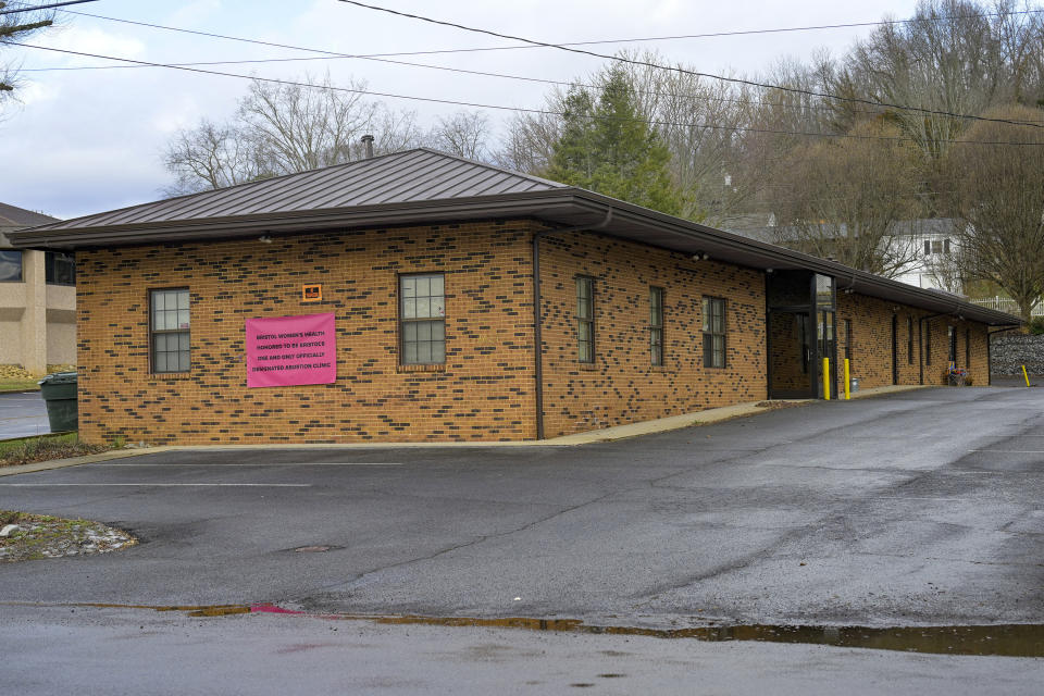 A temporary signs hangs on the outside of the Bristol Women's Health Clinic on Thursday, Feb. 23, 2023 in Bristol,Va., Residents in southwestern Virginia have battled for months over whether abortion clinics limited by strict laws in other states should be allowed to hop over the border and operate there. Similar scenarios are beginning to play out in communities along state lines around the country since the U.S. Supreme Court overturned Roe v. Wade. (AP Photo/Earl Neikirk)