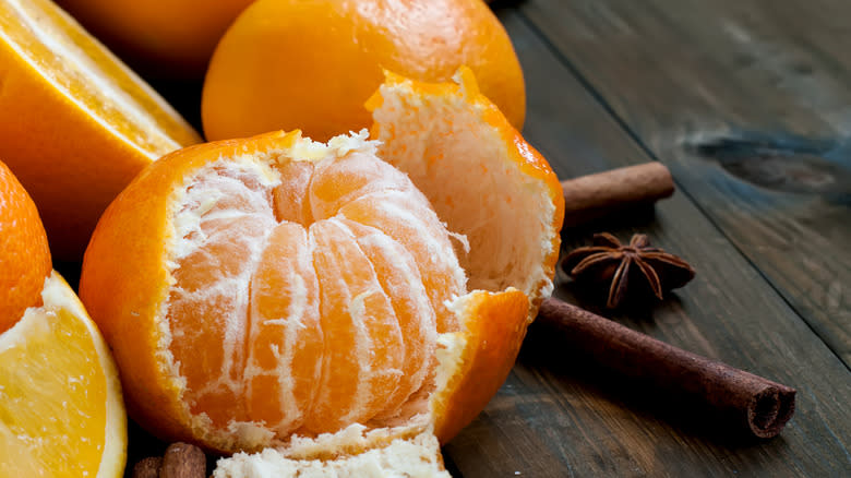 clementines with cinnamon sticks