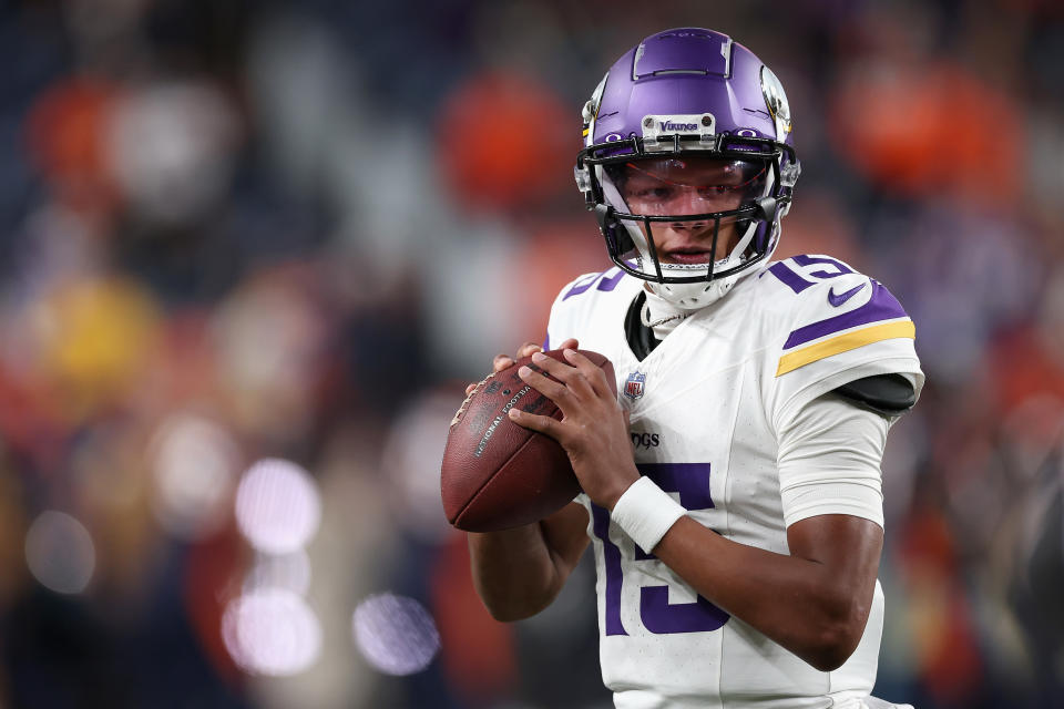 DENVER, COLORADO – NOVEMBER 19: Quarterback Joshua Dobbs #15 of the <a class="link " href="https://sports.yahoo.com/nfl/teams/minnesota/" data-i13n="sec:content-canvas;subsec:anchor_text;elm:context_link" data-ylk="slk:Minnesota Vikings;sec:content-canvas;subsec:anchor_text;elm:context_link;itc:0">Minnesota Vikings</a> warms up before the NFL game against the Denver Broncos at Empower Field At Mile High on November 19, 2023 in Denver, Colorado. (Photo by Matthew Stockman/Getty Images)