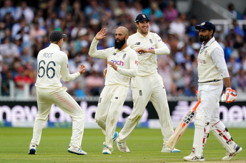 Englands Moeen Ali and Joe Root celebrate after dismissing Indias Ravindra Jadeja (right) during day four of the cinch Second Test match at Lord's, London. Picture date: Sunday August 15, 2021. (Photo by Zac Goodwin/PA Images via Getty Images)