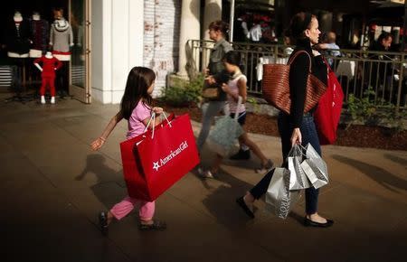 People shop at The Grove mall in Los Angeles November 26, 2013. REUTERS/Lucy Nicholson