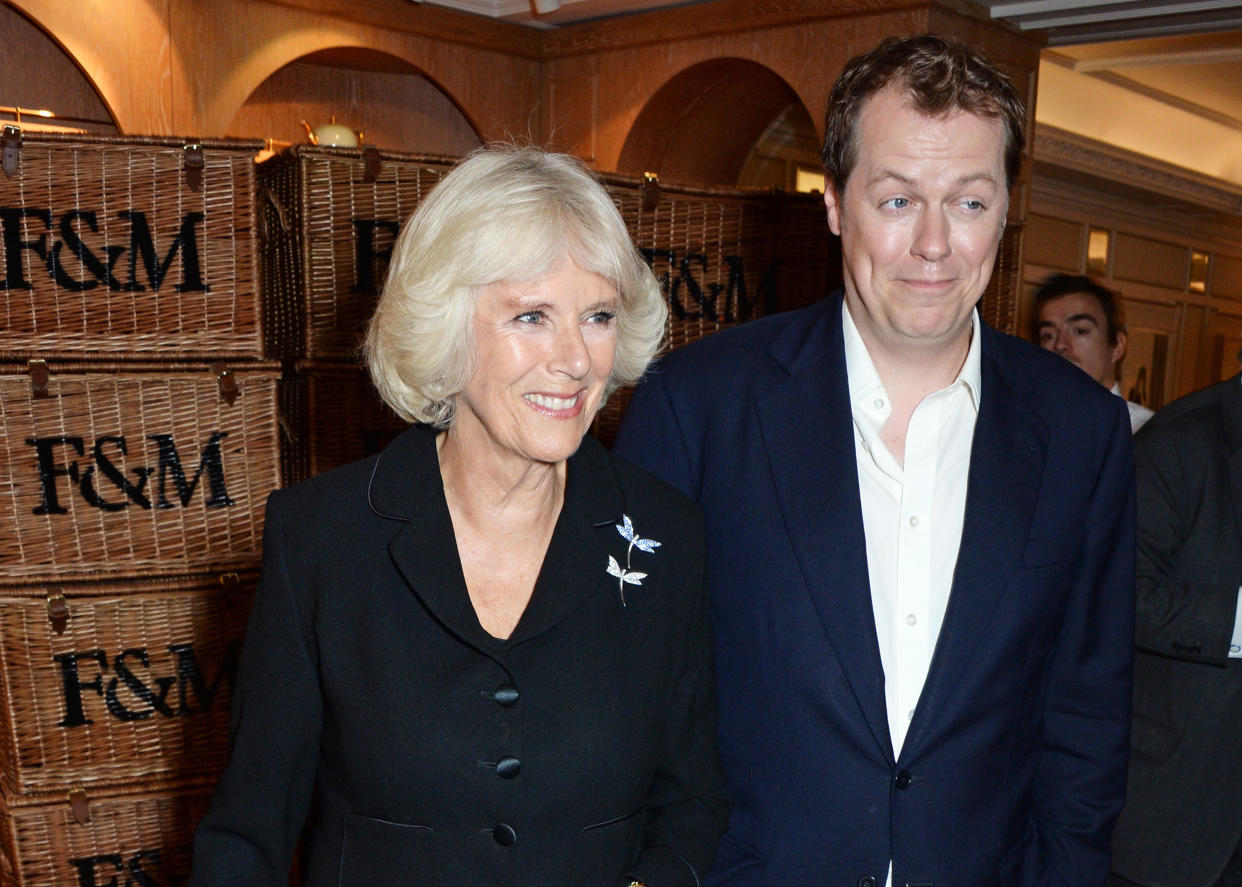 LONDON, ENGLAND - OCTOBER 21:  Camilla, Duchess of Cornwall, and son Tom Parker Bowles attend Fortnum & Mason's Diamond Jubilee Tea Salon for the launch of Tom Parker Bowles' new book 