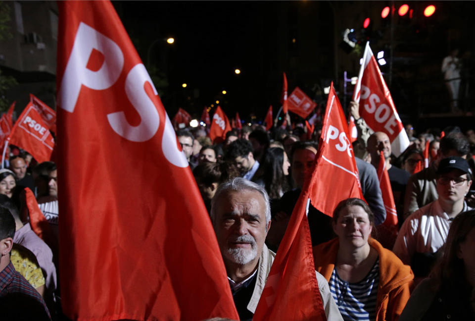 Supporters of Spanish Prime Minister and Socialist Party candidate Pedro Sanchez react as they gather at the party headquarters waiting for results of the general election in Madrid, Sunday, April 28, 2019. A divided Spain voted Sunday in its third general election in four years, with all eyes on whether a far-right party will enter Parliament for the first time in decades and potentially help unseat the Socialist government. (AP Photo/Andrea Comas)