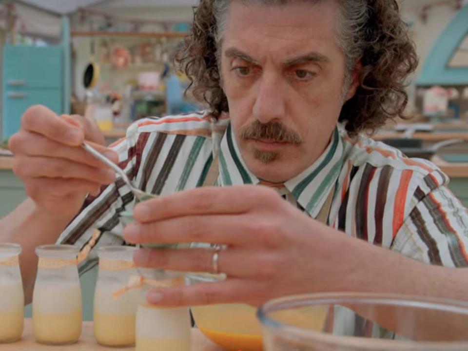 Giuseppe Dell'Anno spooning custard into glass jars