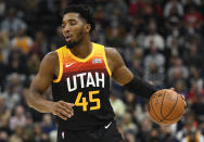 Utah Jazz guard Donovan Mitchell brings the ball up during the first half of the team's NBA basketball game against the New Orleans Pelicans on Friday, Nov. 26, 2021, in Salt Lake City. (AP Photo/Alex Goodlett)