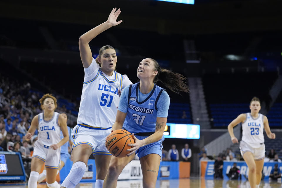 Creighton forward Emma Ronsiek (31) is defended by UCLA center Lauren Betts (51) during the first half of a second-round college basketball game in the women's NCAA Tournament, Monday, March 25, 2024, in Los Angeles. (AP Photo/Marcio Jose Sanchez)