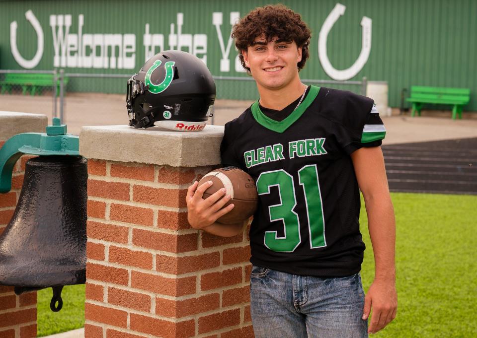 Clear Fork senior Kasey Swank sports his late father's No. 31 along with a helmet decal dedicated to 2002 alum Charles Swank, who died in December.