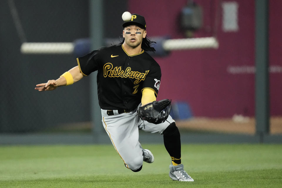 Pittsburgh Pirates right fielder Connor Joe catches a fly ball for the out on Kansas City Royals' Kyle Isbel during the third inning of a baseball game Wednesday, Aug. 30, 2023, in Kansas City, Mo. (AP Photo/Charlie Riedel)