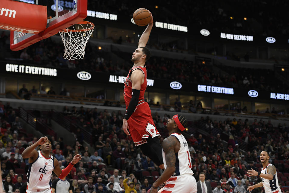 Chicago Bulls' Zach La Vine (8) dunks during the second half of an NBA basketball game against the Washington Wizards Sunday, Feb. 23, 2020, in Chicago. Chicago won 126-117. (AP Photo/Paul Beaty)