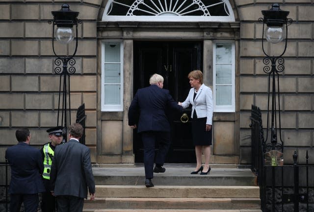 Welcoming then-prime minister Boris Johnson to Bute House