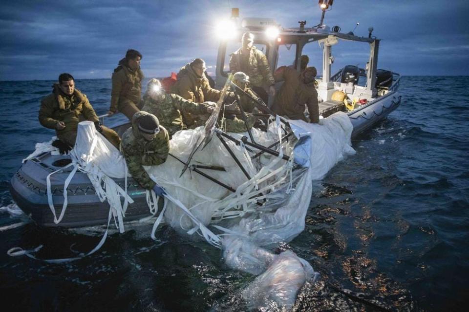 Sailors assigned to Explosive Ordnance Disposal Group 2 recover a high-altitude surveillance balloon off the coast of Myrtle Beach, South Carolina, Feb. 5, 2023.