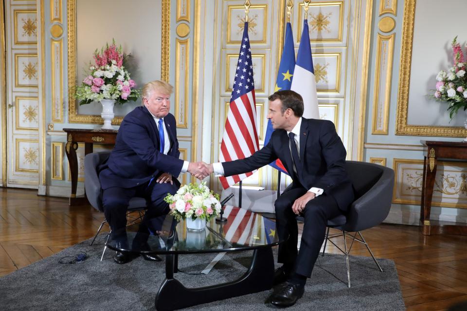 US President Donald Trump (L) shakes hands during a meeting with the French President Emmanuel Macron at the Prefecture of Caen, Normandy, north-western France, on June 6, 2019, on the sidelines of D-Day commemorations marking the 75th anniversary of the World War II Allied landings in Normandy. (Photo by Ludovic MARIN / POOL / AFP)        (Photo credit should read LUDOVIC MARIN/AFP/Getty Images)