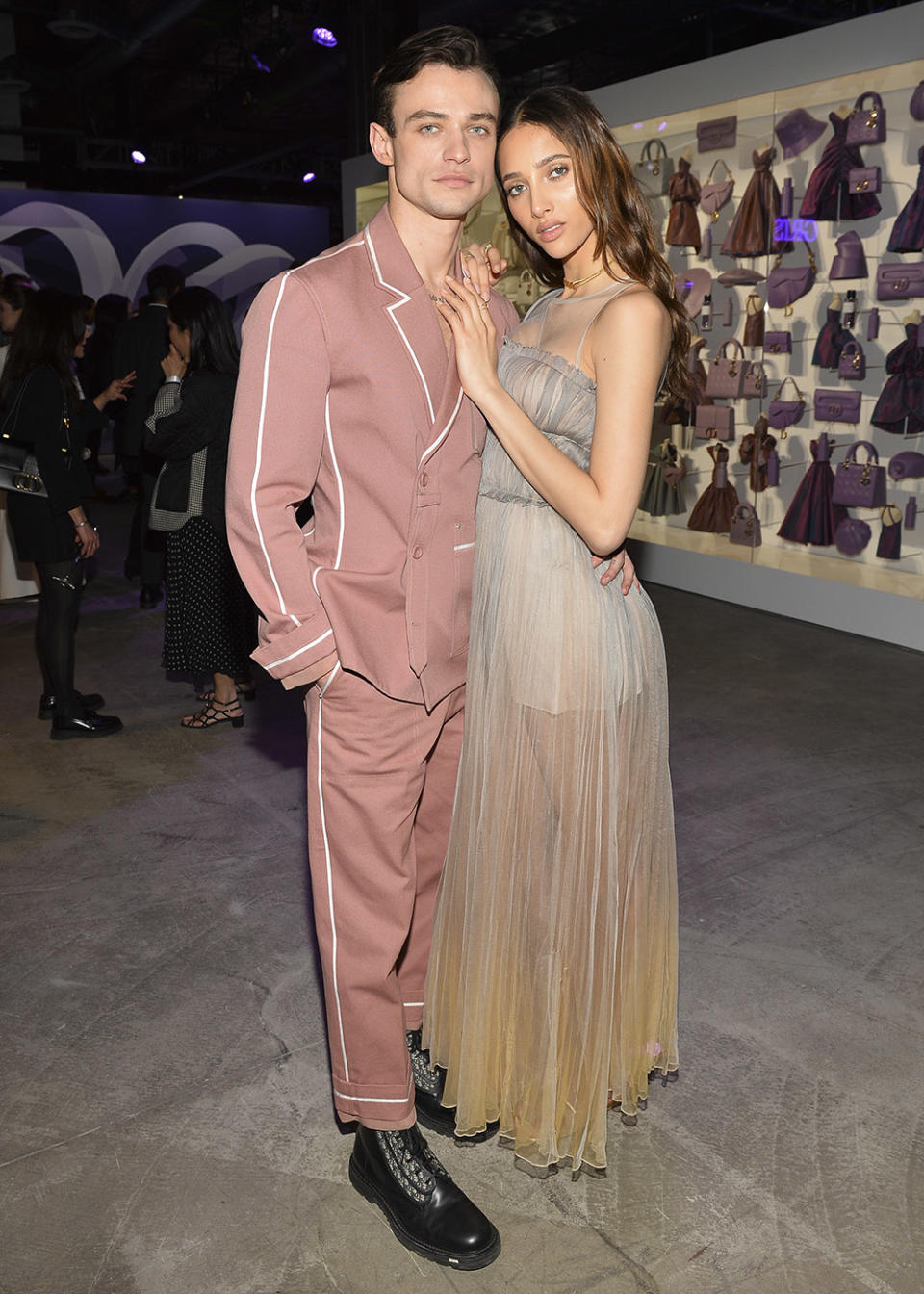 (L-R) Thomas Doherty and Yasmin Wijnaldum attend Dare In Gris Dior The Grey Zone Opening on April 11, 2023 in Los Angeles, California.