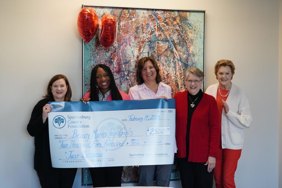 The Spartanburg County Foundation presents Beauty Marks for Girls founder Jennifer Jones with a  'Just Because' grant, Valentine's Day 2023.