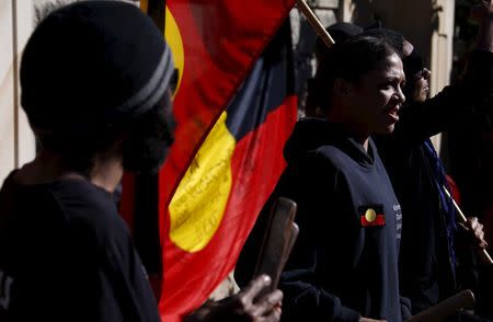 Aboriginal protesters hold banners and chant slogans during a protest outside a government office building in Sydney, Australia, July 6, 2015. REUTERS/David Gray